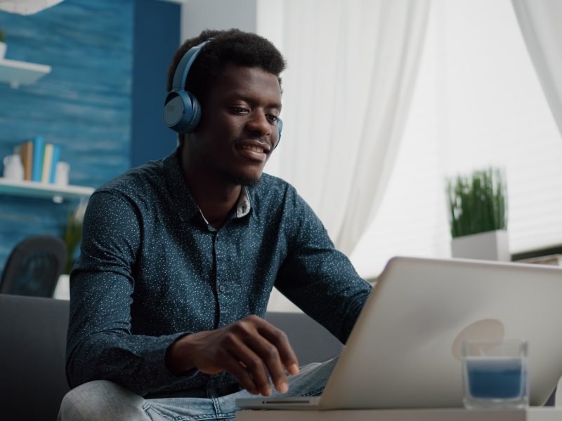 african-american-man-with-headphone-on-watching-movie-on-streaming-services.jpg